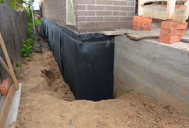 SJ Waterproofing Pros technician performing targeted Basement Waterproofing assessment in Atwood, IN